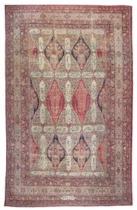 A Kirman Wool Rug 12 feet 6 inches x 6 feet 10 inches.