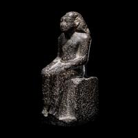 An Egyptian Diorite Seated Figure