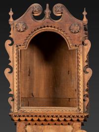 A Folk Art Carved Maple Clock Case