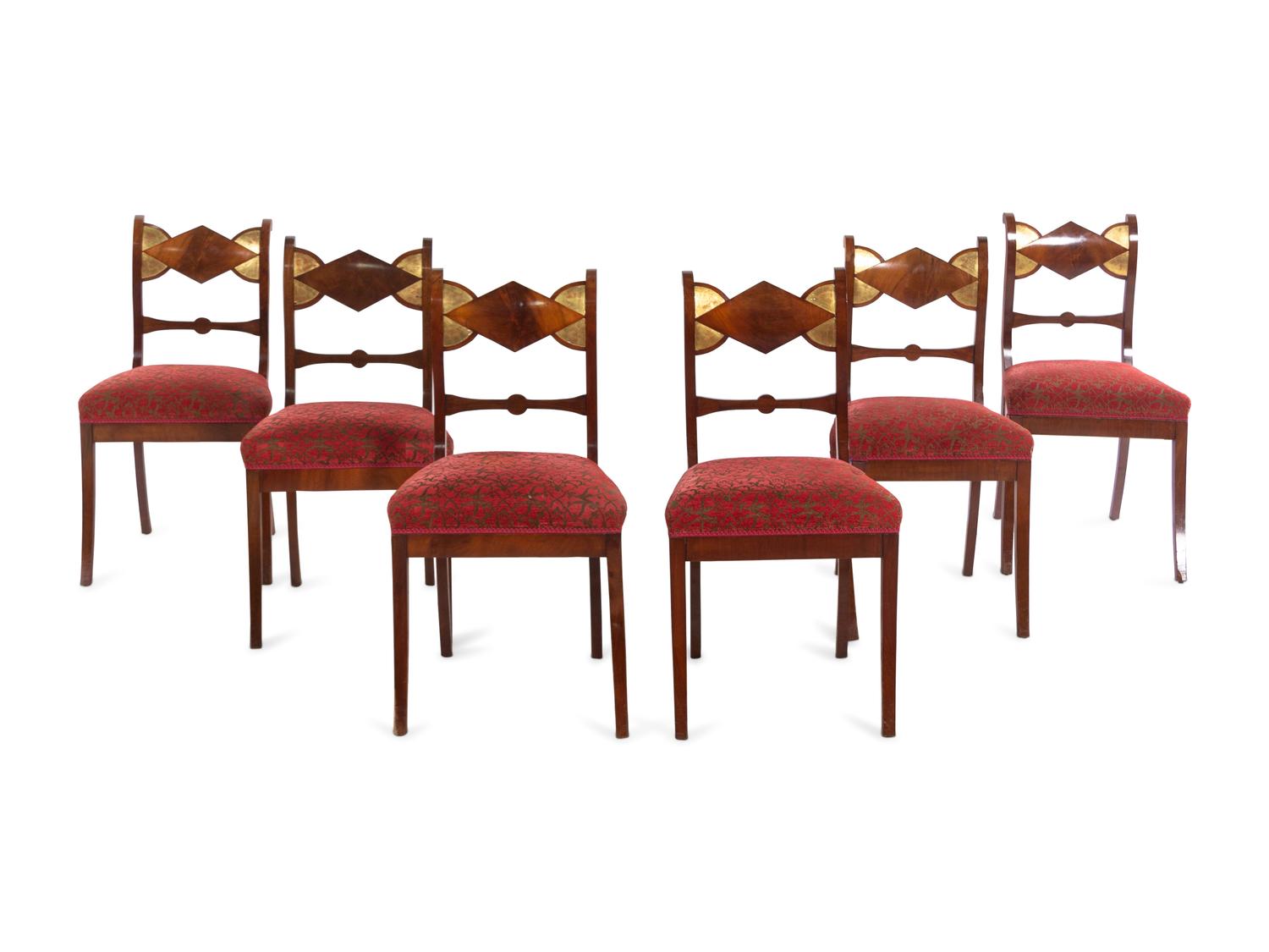 A Set of Six German Parcel Gilt Mahogany Dining Chairs