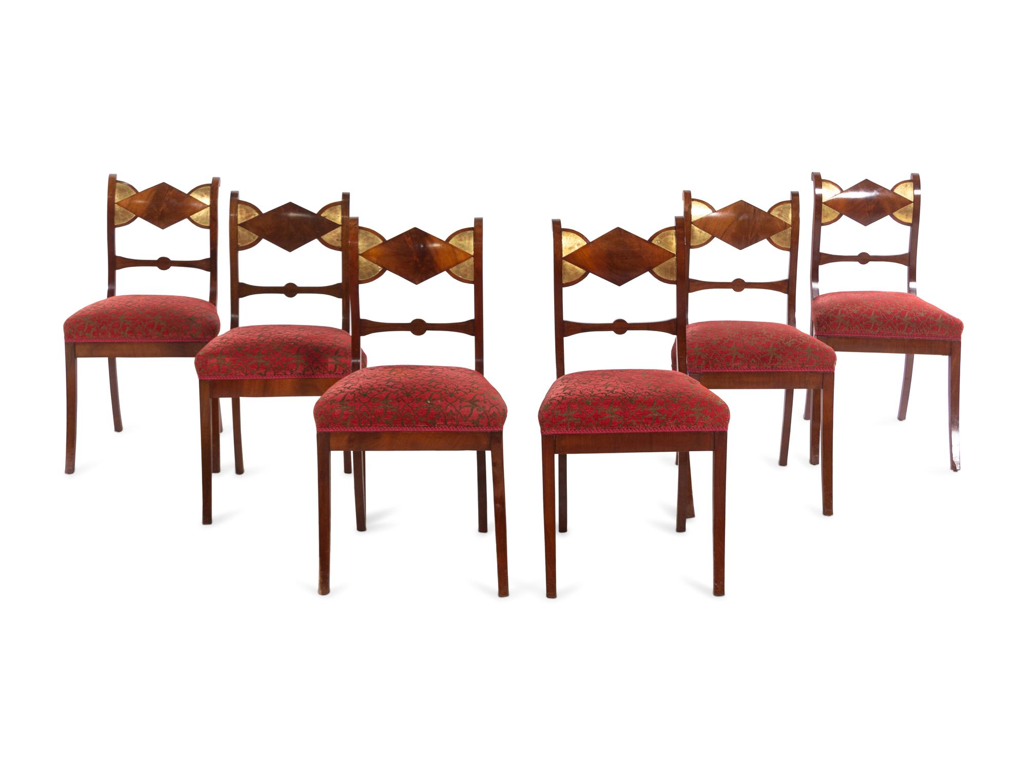 A Set of Six German Parcel Gilt Mahogany Dining Chairs