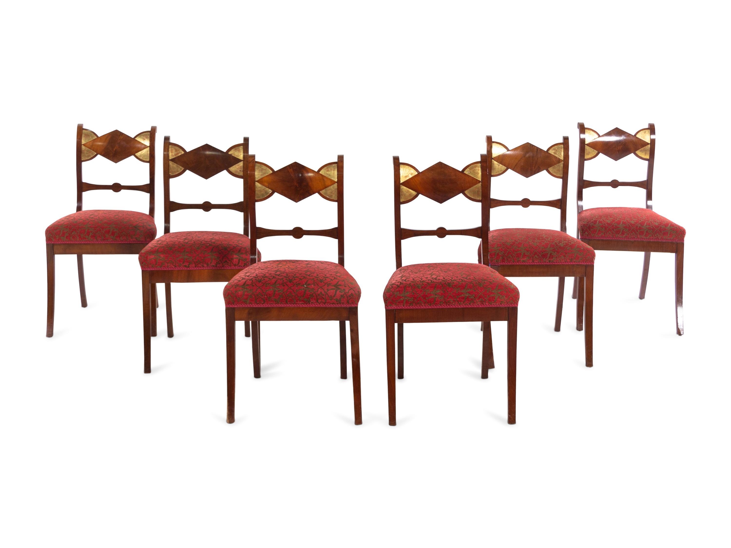 A Set of Six German Parcel Gilt Mahogany Dining Chairs