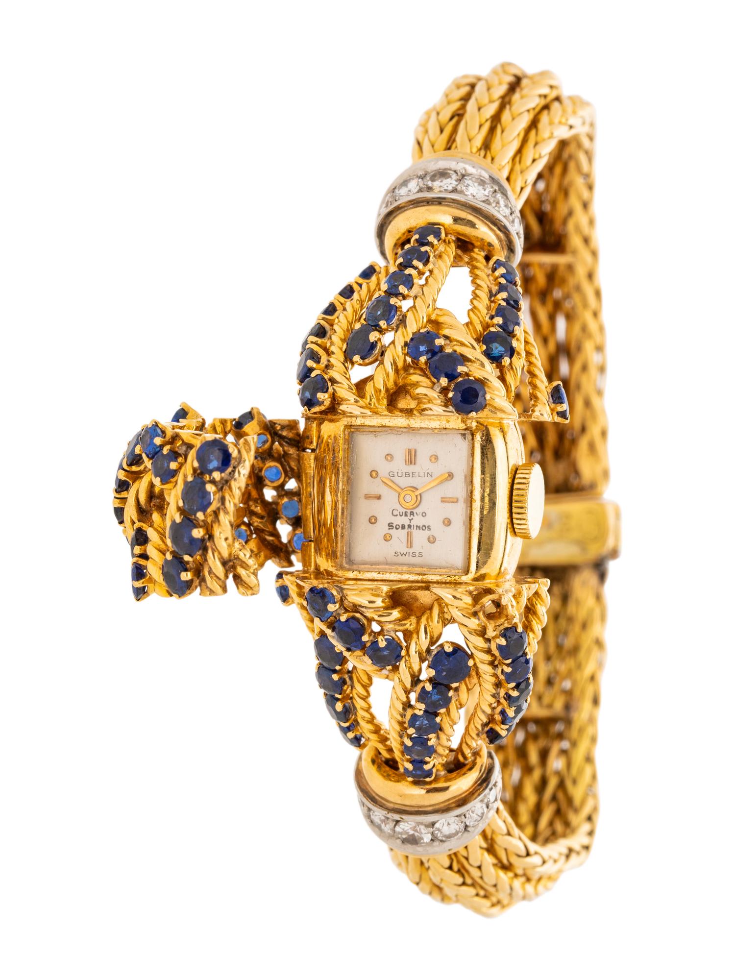 GÜBELIN, YELLOW GOLD, SAPPHIRE AND DIAMOND SURPRISE WATCH