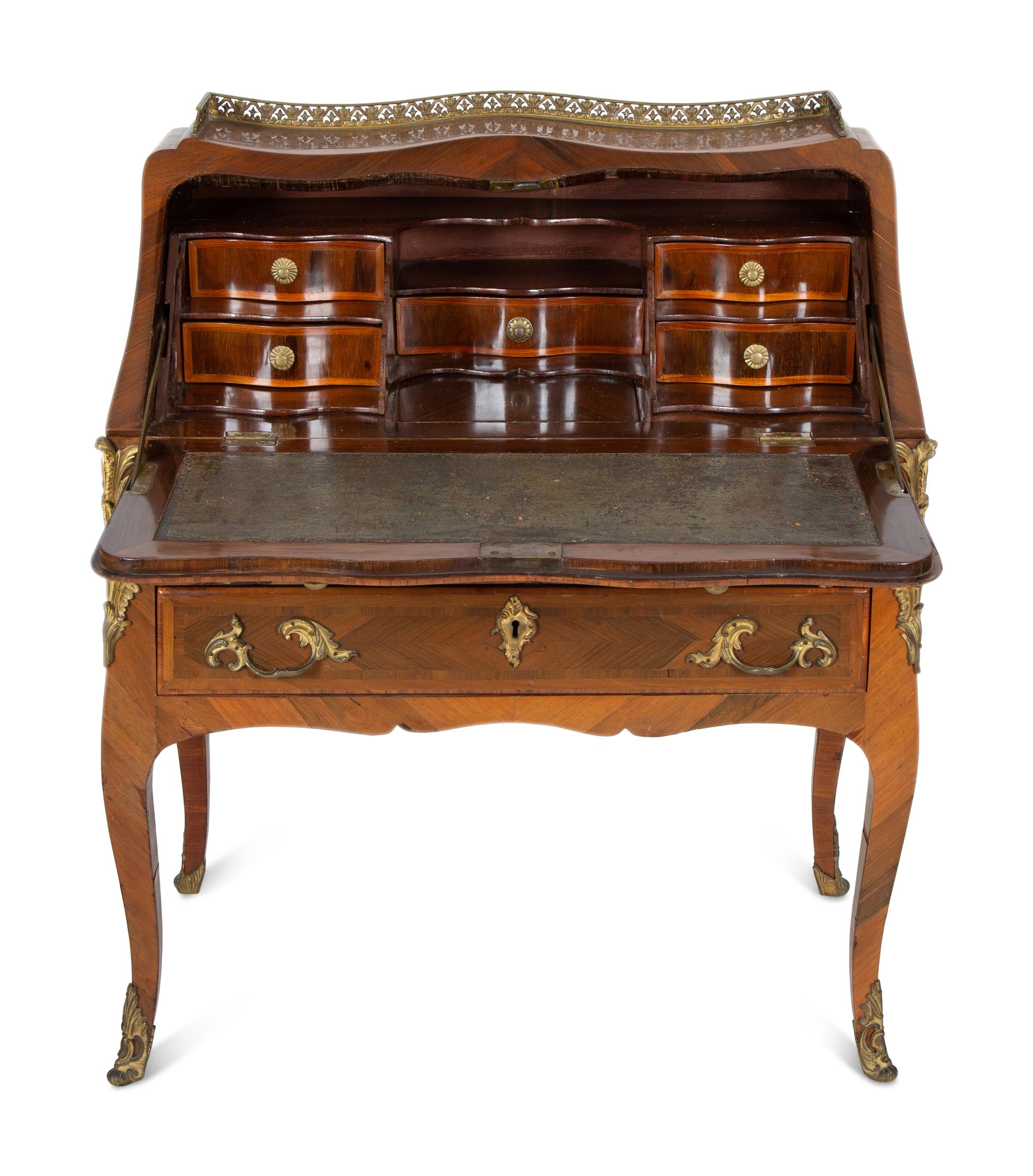 A Louis XV Style Parquetry Inlaid Writing Desk with Brass Gallery