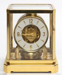 A Swiss Brass and Glass Atmos Clock, LeCoultre Height 9 1/4 x width 8 1/4 x depth 6 1/2 inches.