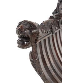 An Italian Renaissance Revival Carved Walnut Savonarola Armchair
