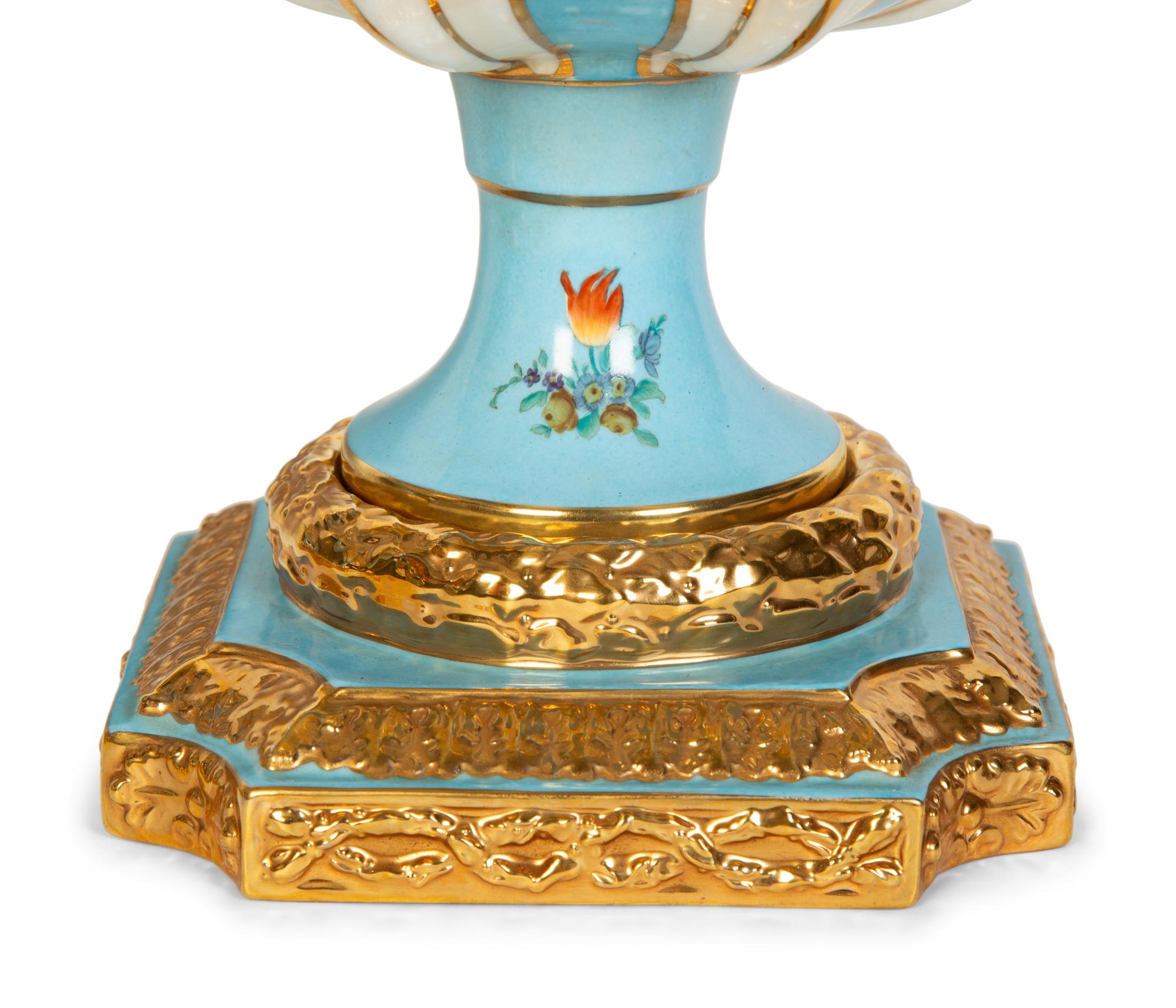 A Pair of Sèvres Style Porcelain Urns
