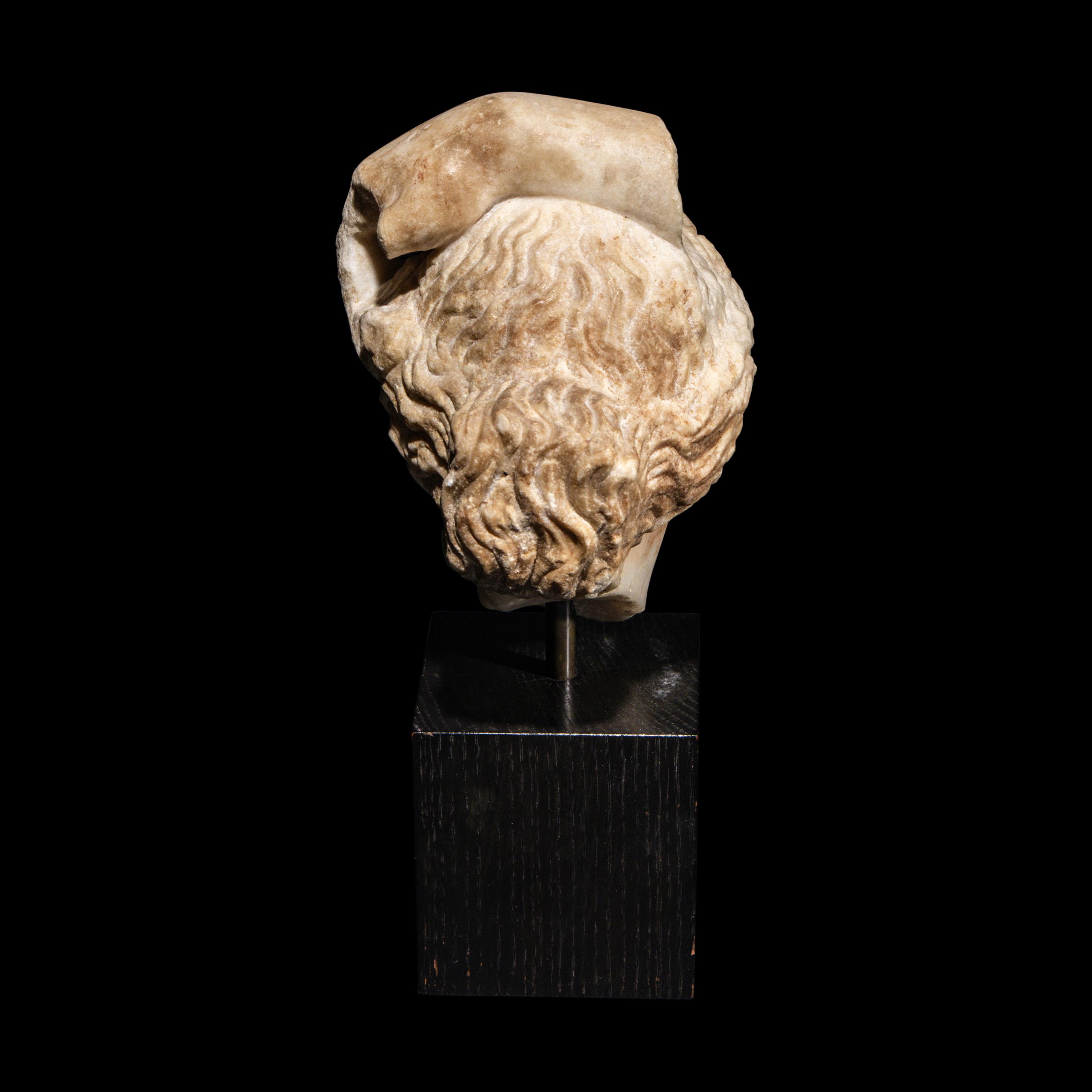 A Roman Marble Head of Apollo Lykeios