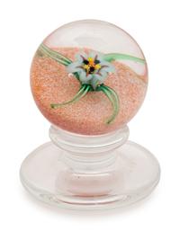 A Charles Kaziun Jr. White Spider Lily on Orange Ground Miniature Tilted Pedestal Glass Paperweight