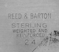 A Pair of American Silver Three-Light Candelabra, Reed & Barton, Taunton, MA, having two twist arms with reeded decoration issuing from