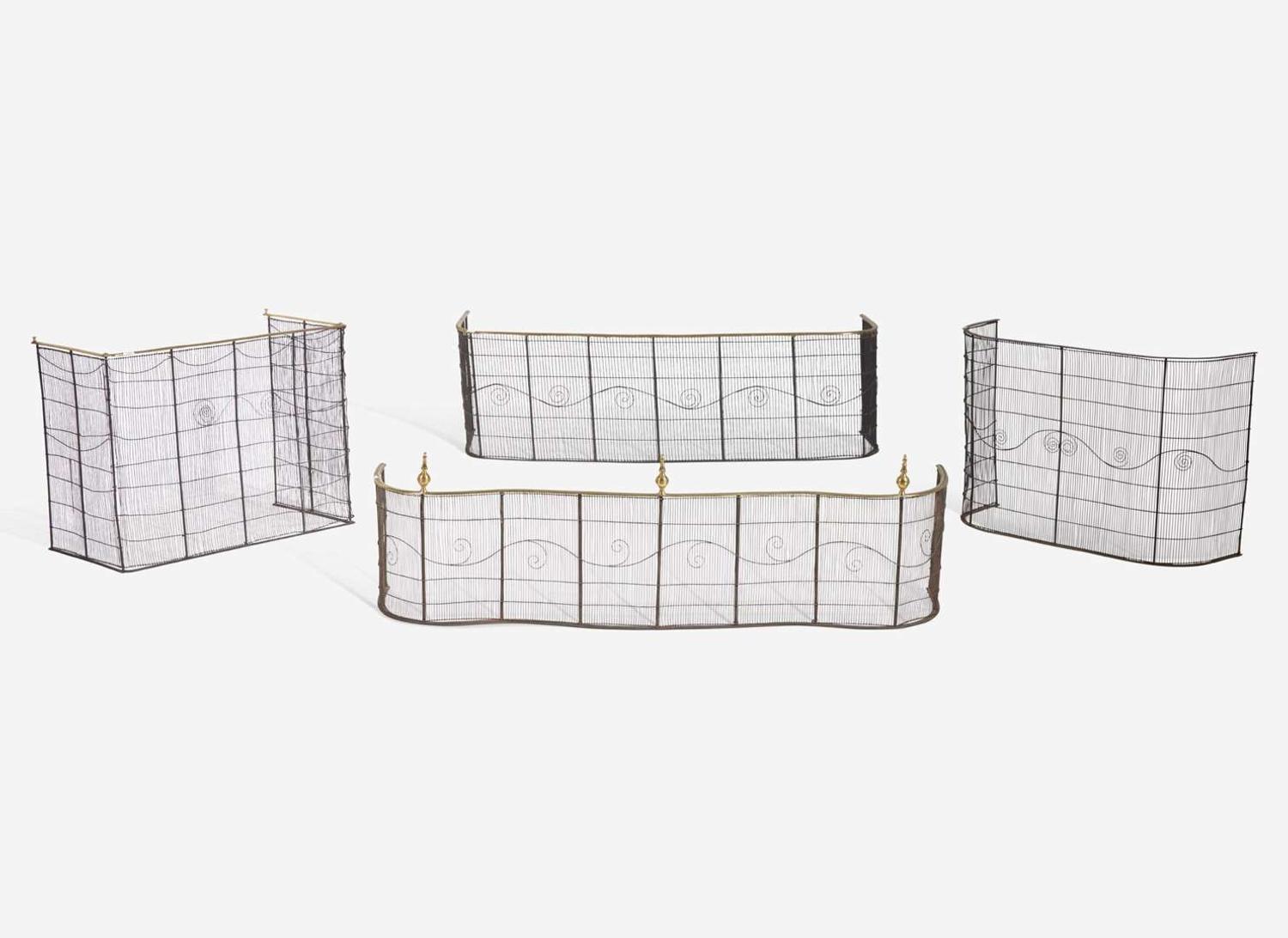 A group of four Federal brass and wirework fireplace screens and fenders, circa 1800