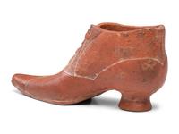 A Glazed Pottery Woman's High-Heeled Shoe