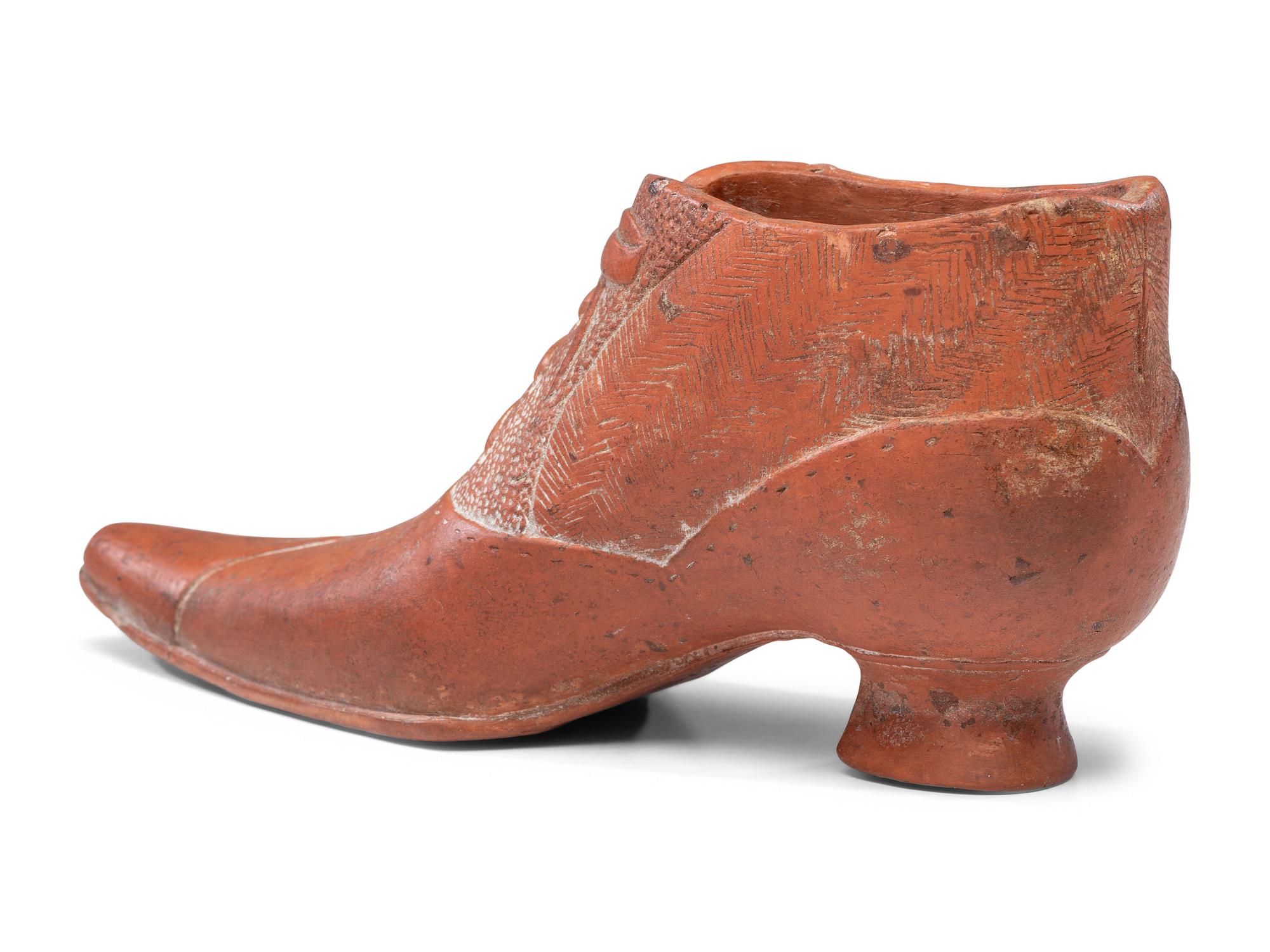 A Glazed Pottery Woman's High-Heeled Shoe