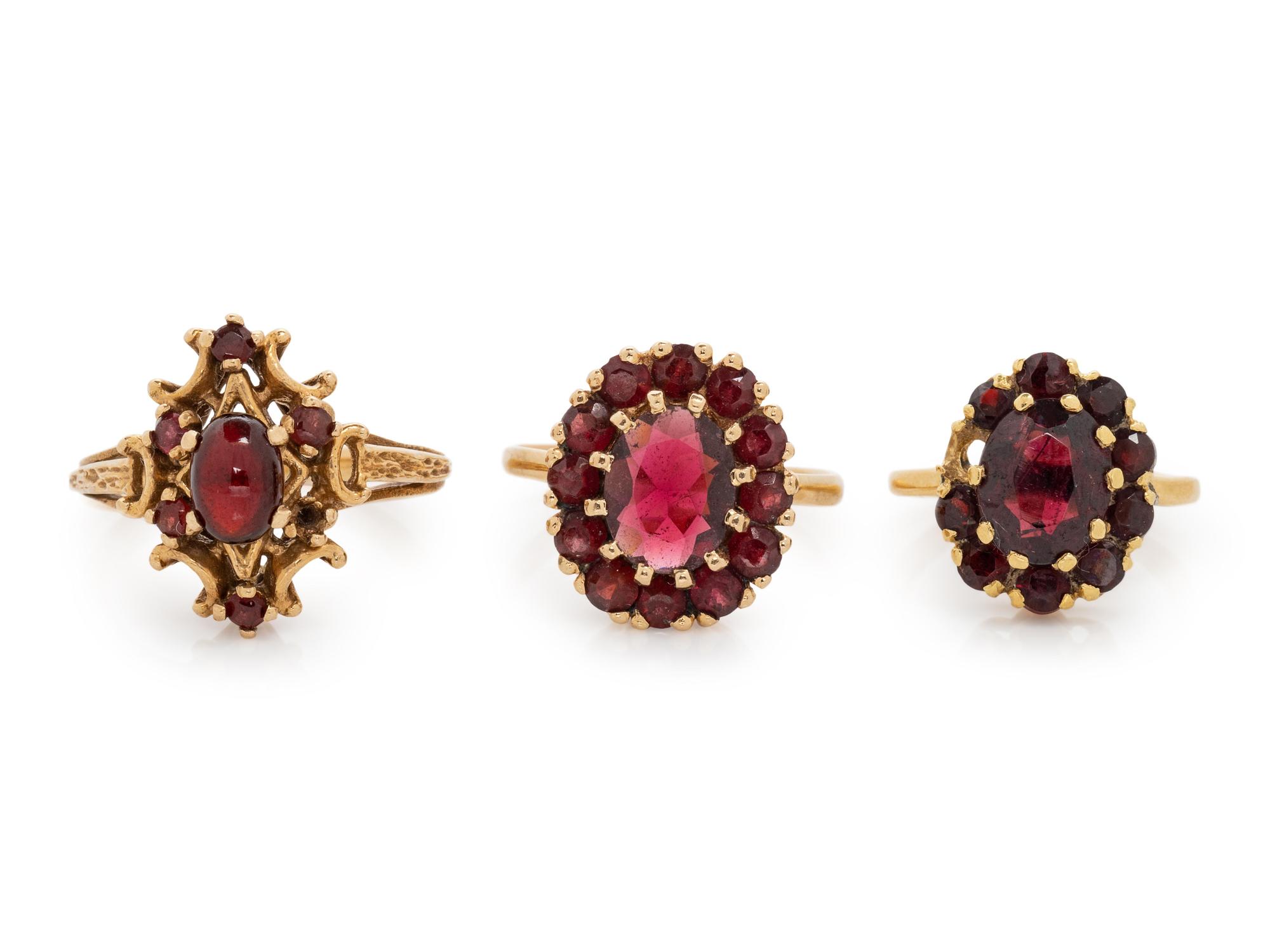 A Collection of Yellow Gold and Garnet Rings,