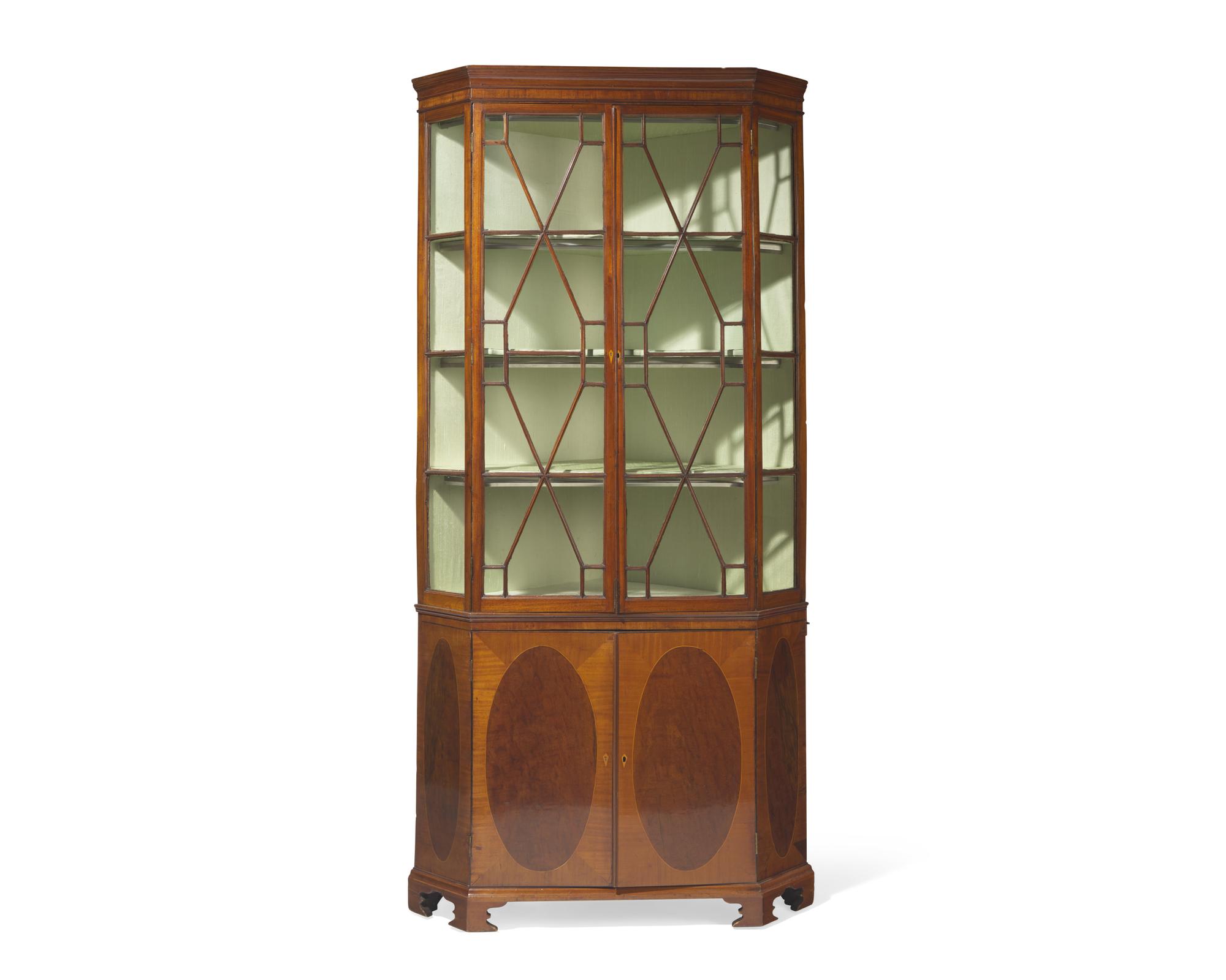 A fine George III inlaid mahogany and satinwood corner cupboard, circa 1790