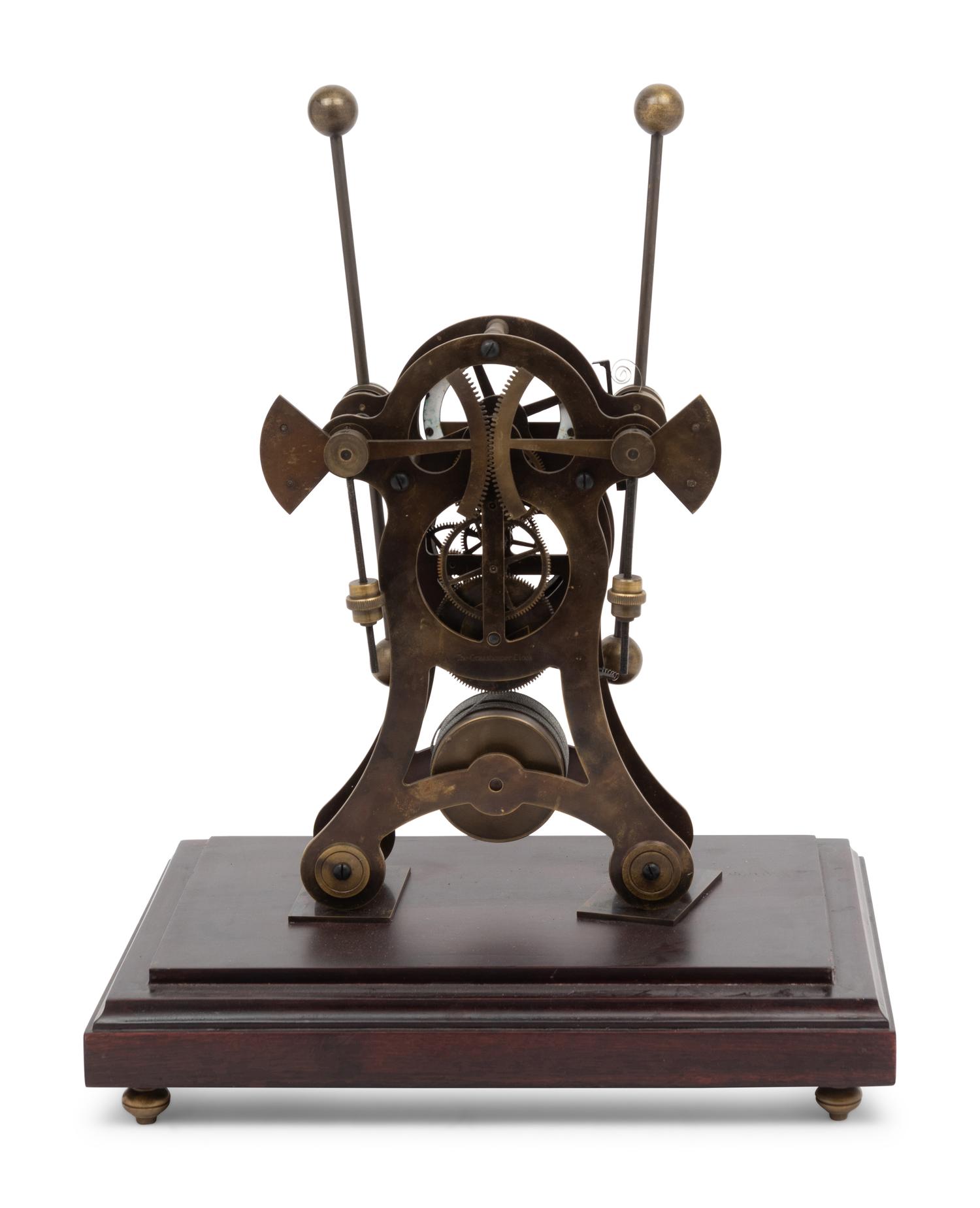 A Continental Cased Brass Skeleton Clock