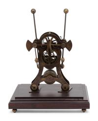 A Continental Cased Brass Skeleton Clock