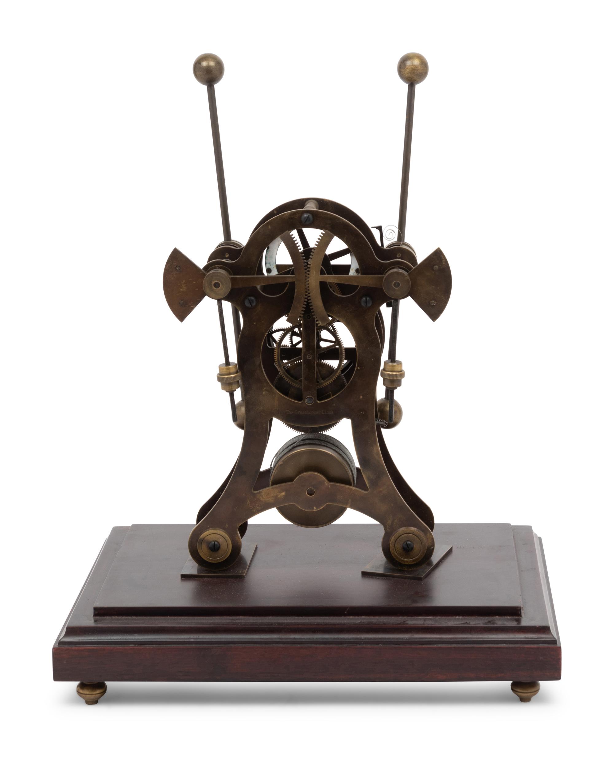 A Continental Cased Brass Skeleton Clock