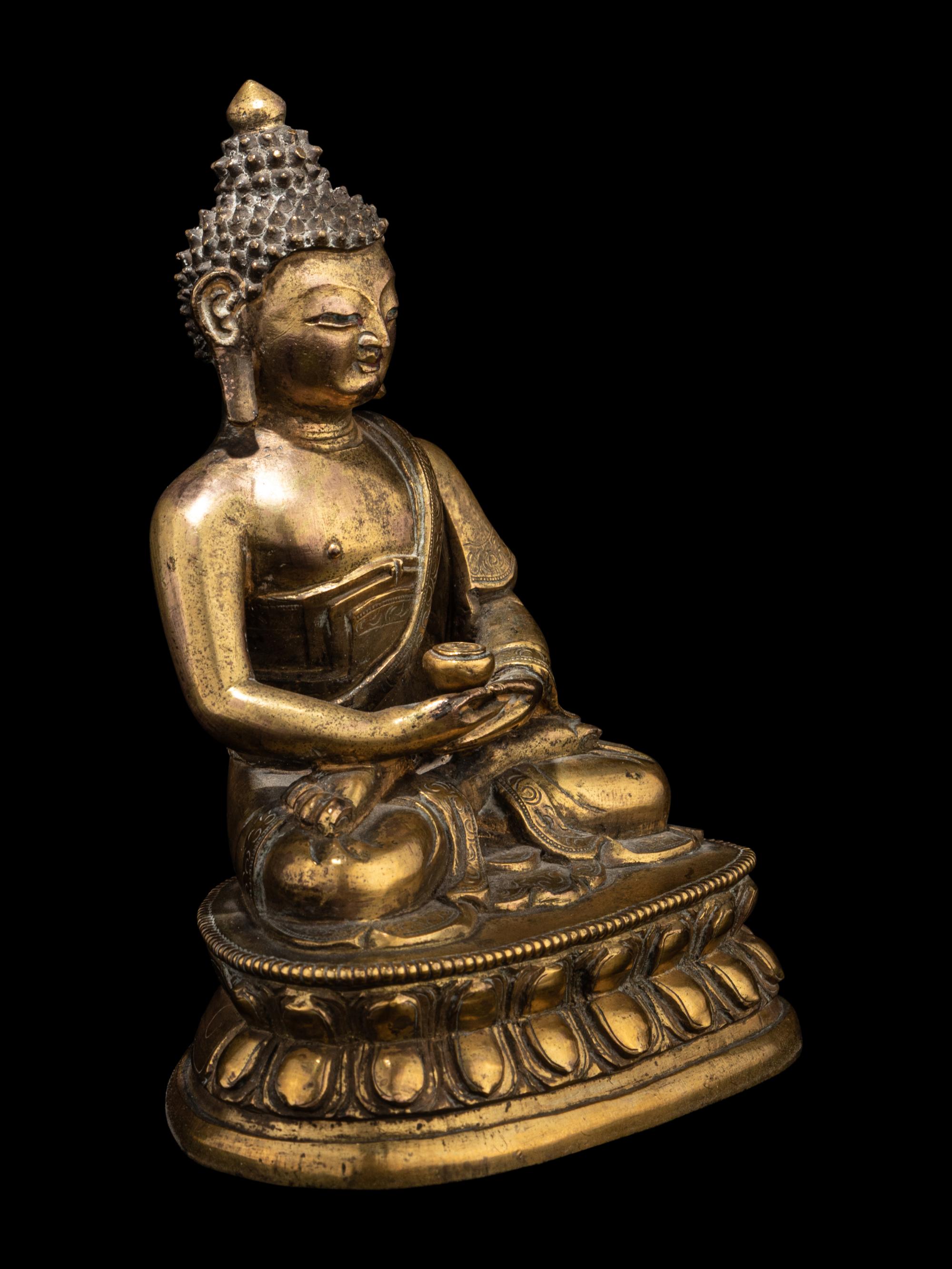 A Small Tibetan Gilt Bronze Figure of Medicine Buddha