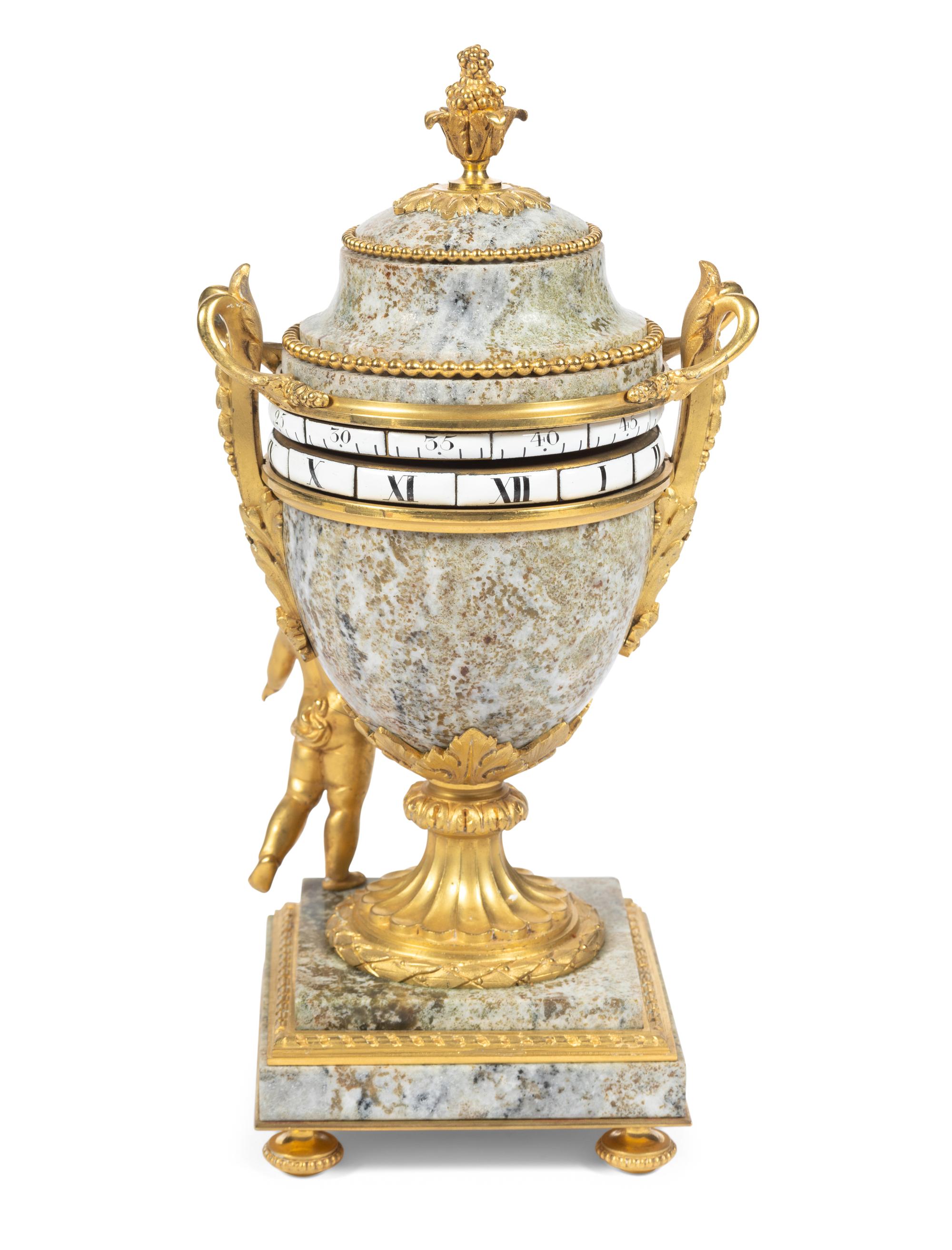 A Louis XVI Style Gilt Bronze and Marble Annular Mantel Clock