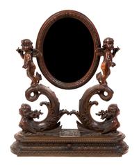A Venetian Carved Walnut Dressing Mirror, Height 32 3/8 x width 25 1/2 inches.