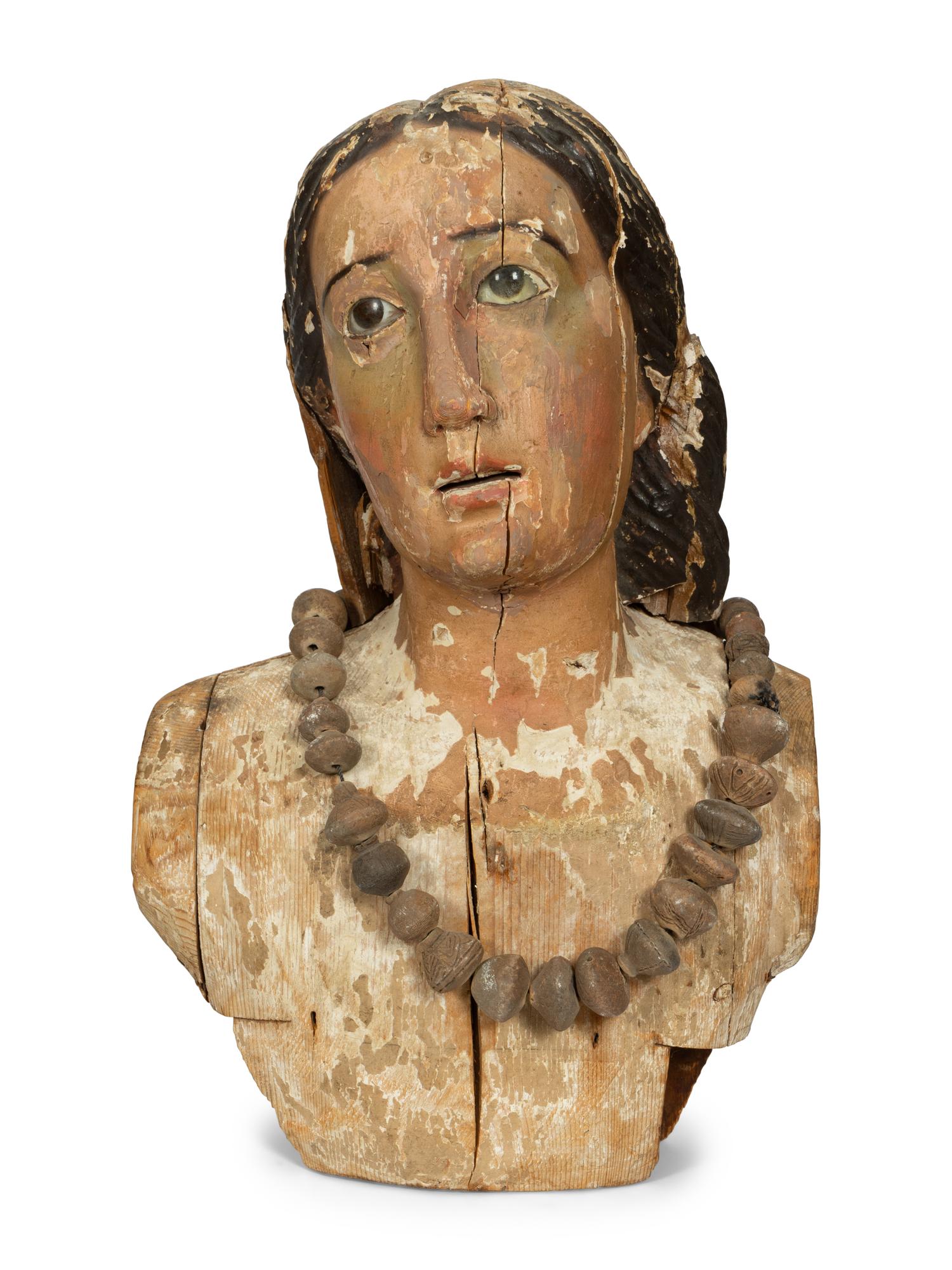 A Continental Carved and Painted Bust of a Saint