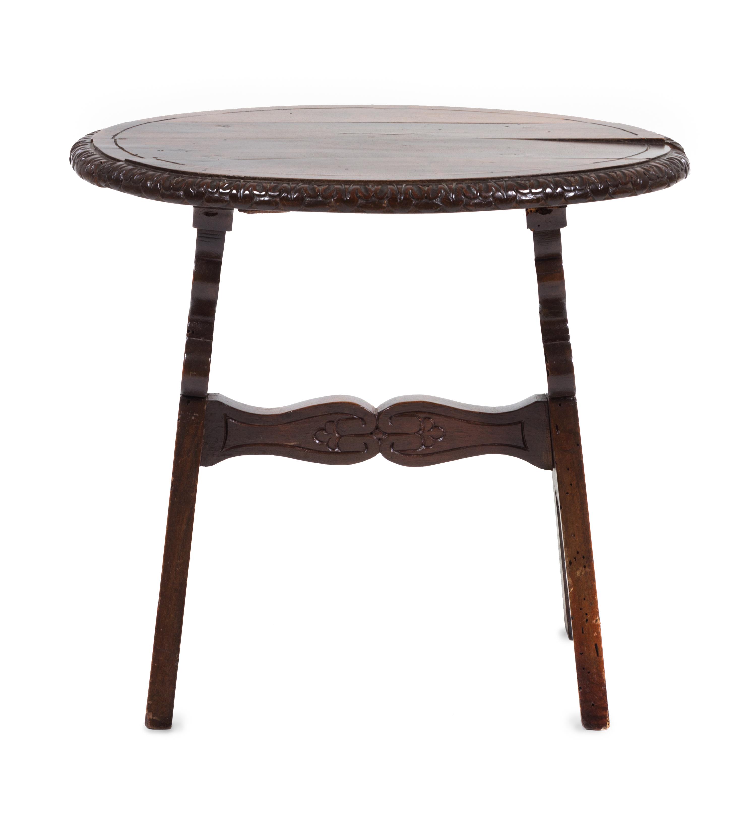 A Continental Walnut Stool Height 22 x width 16 x depth 20 1/2 inches.