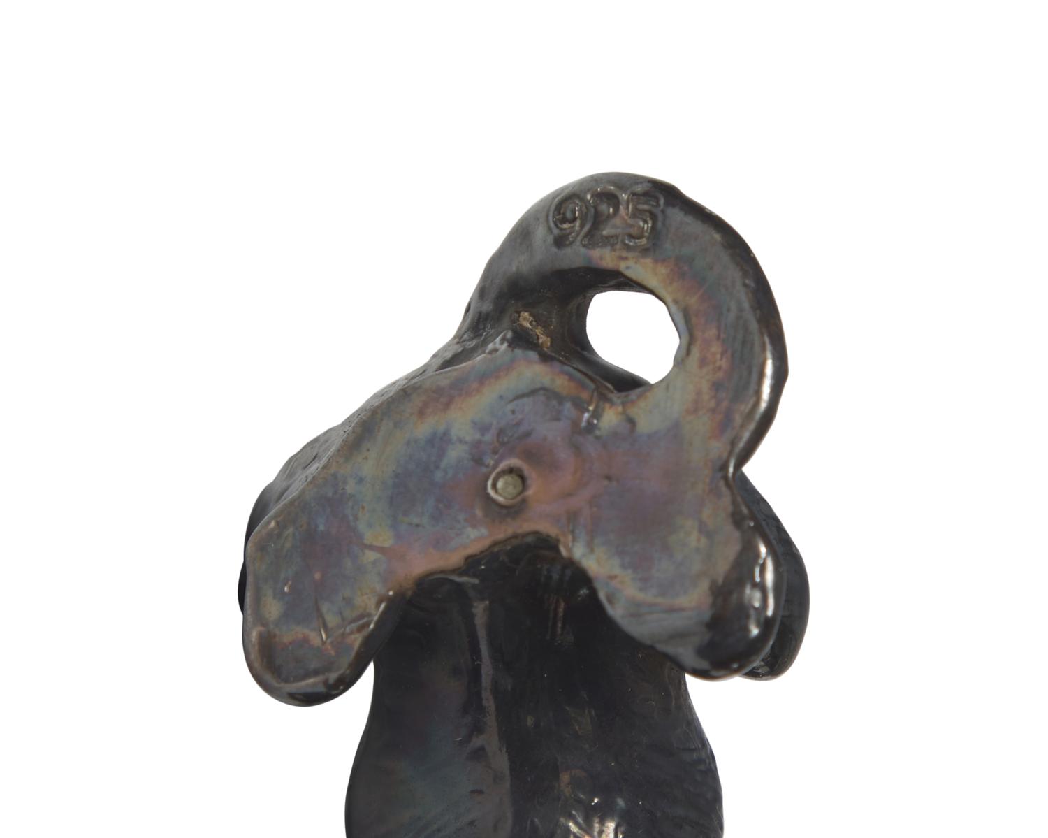 A Collection of Twenty-Five Cast and Painted Metal Dog Figurines