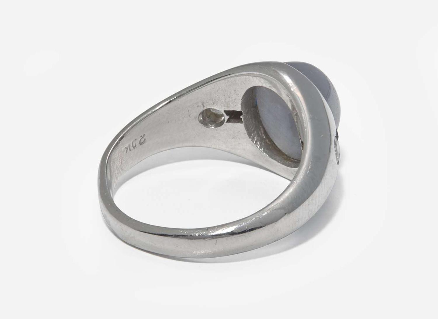 A 20K White Gold, Star Sapphire, and Diamond Ring