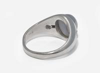 A 20K White Gold, Star Sapphire, and Diamond Ring