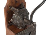 A Bell Cast Iron Wall Mount Coffee Grinder
