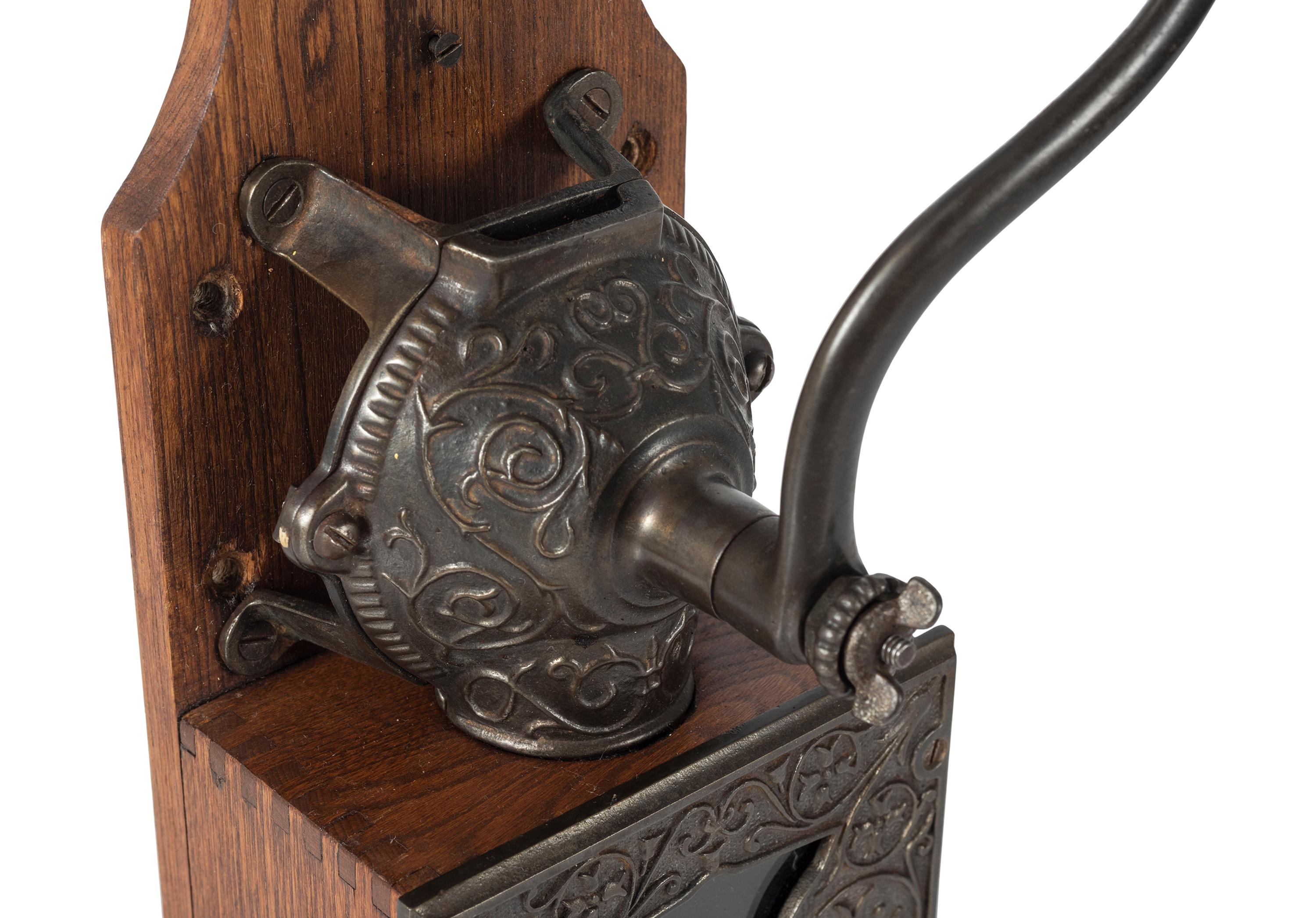 A Bell Cast Iron Wall Mount Coffee Grinder