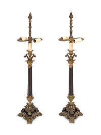 A Pair of Empire Style Gilt and Patinated Bronze Candelabra Mounted as Lamps