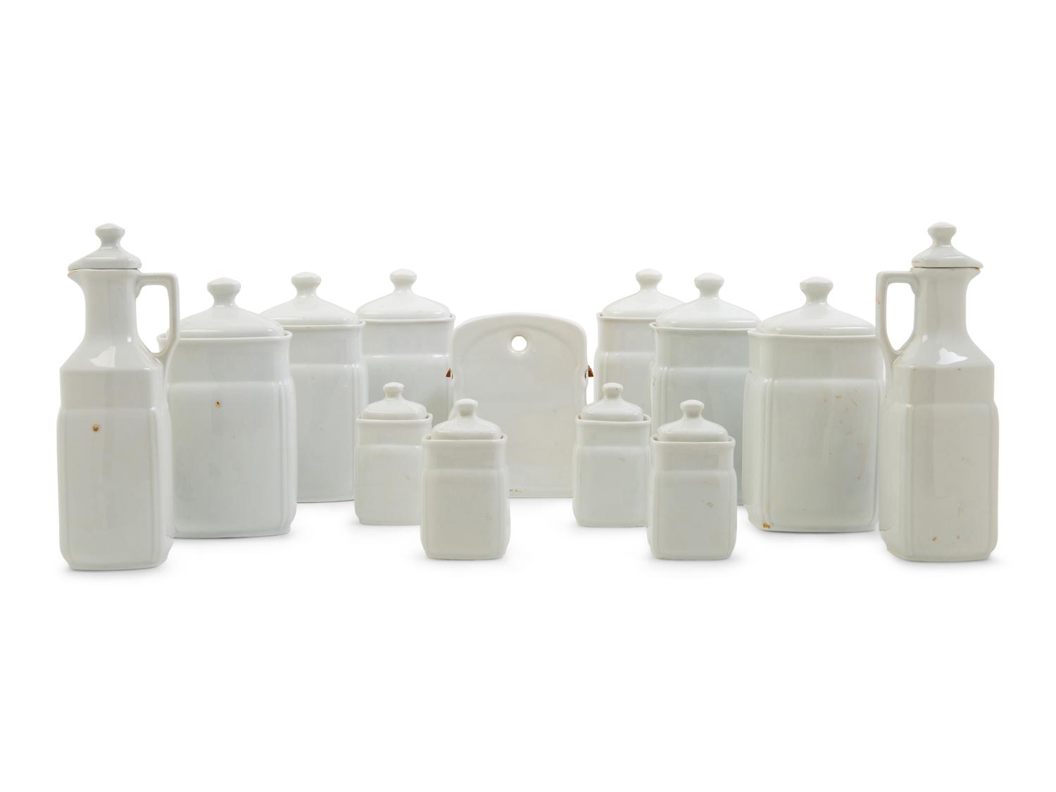 A Set of Thirteen German Porcelain Canisters