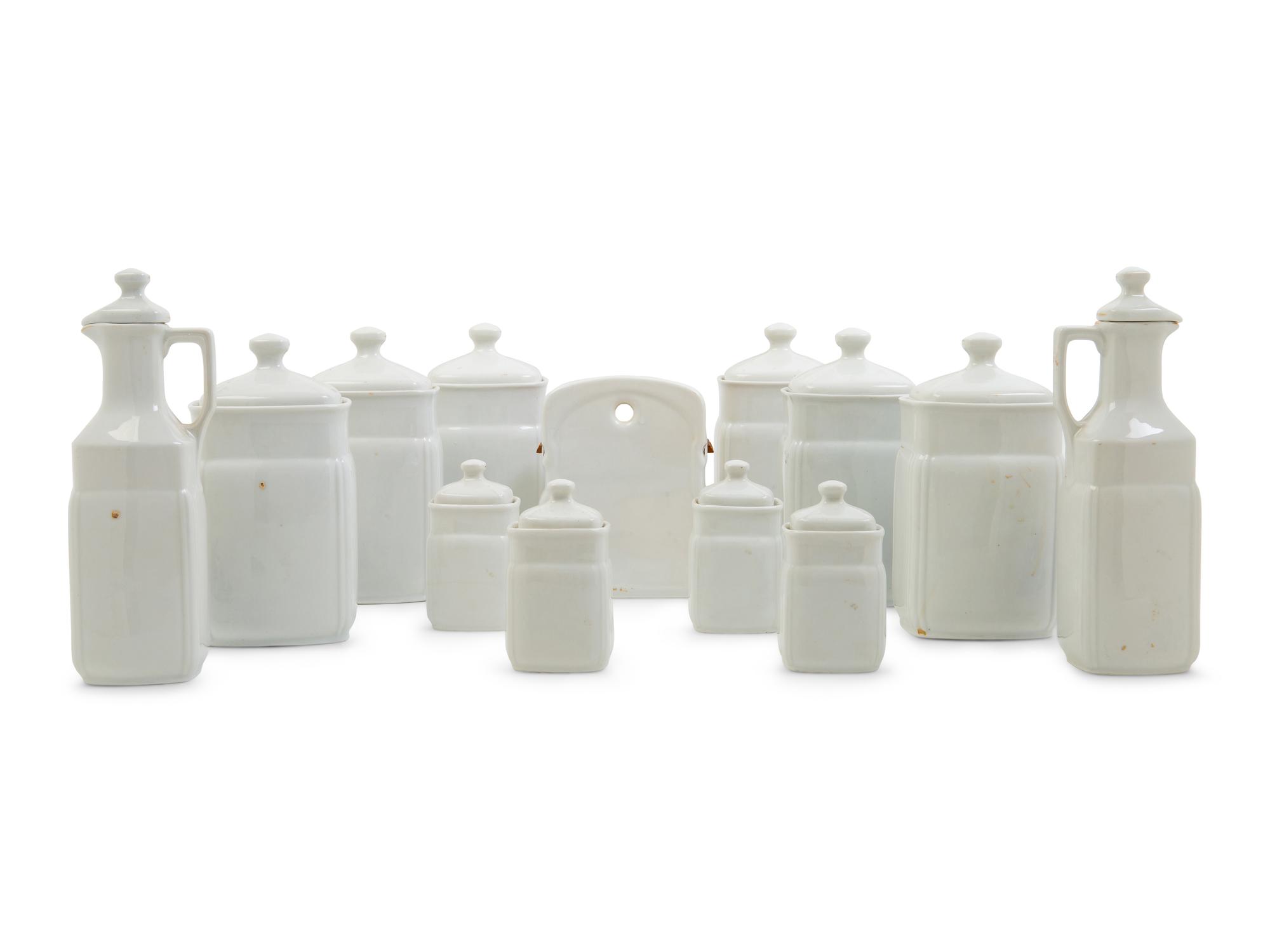 A Set of Thirteen German Porcelain Canisters