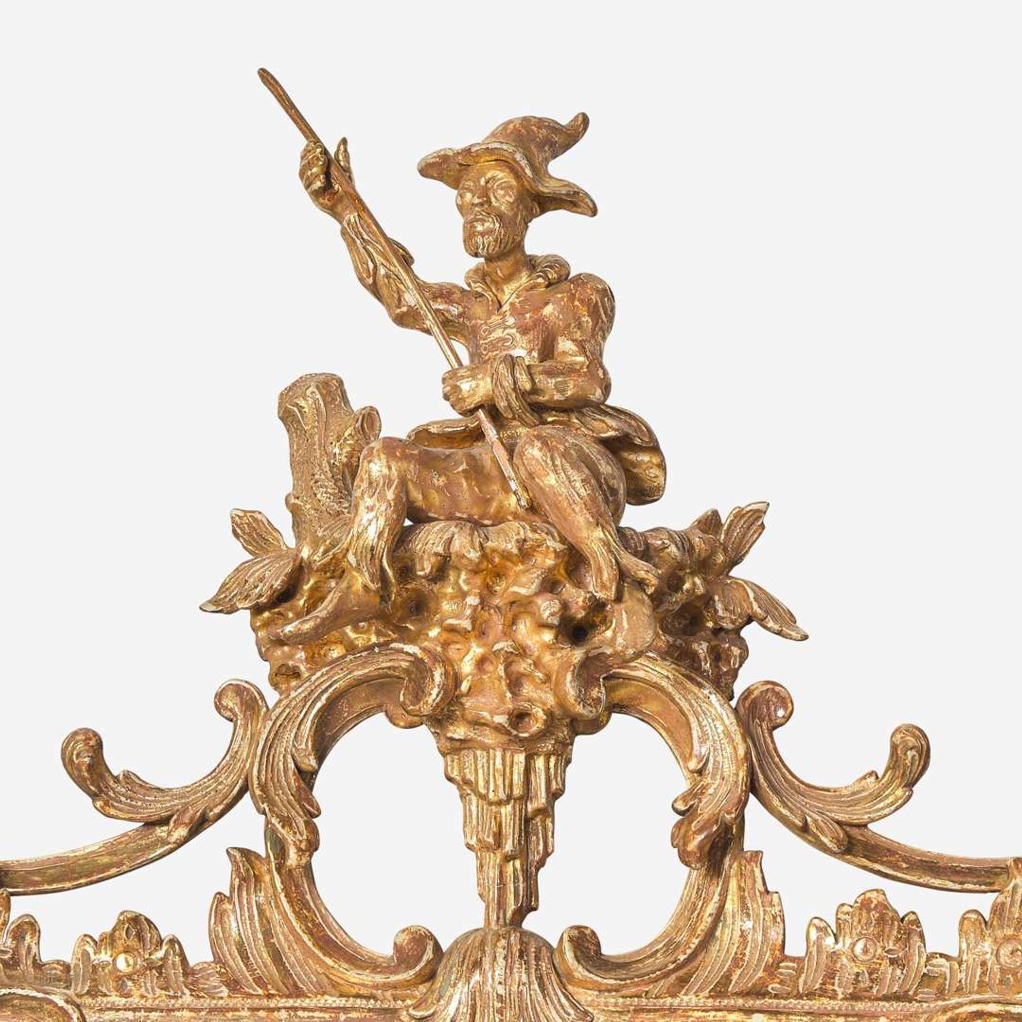 A George III Chippendale carved giltwood looking glass in the Chinese taste circa 1765