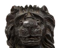 An English Carved and Stained Oak Figure of a Lion