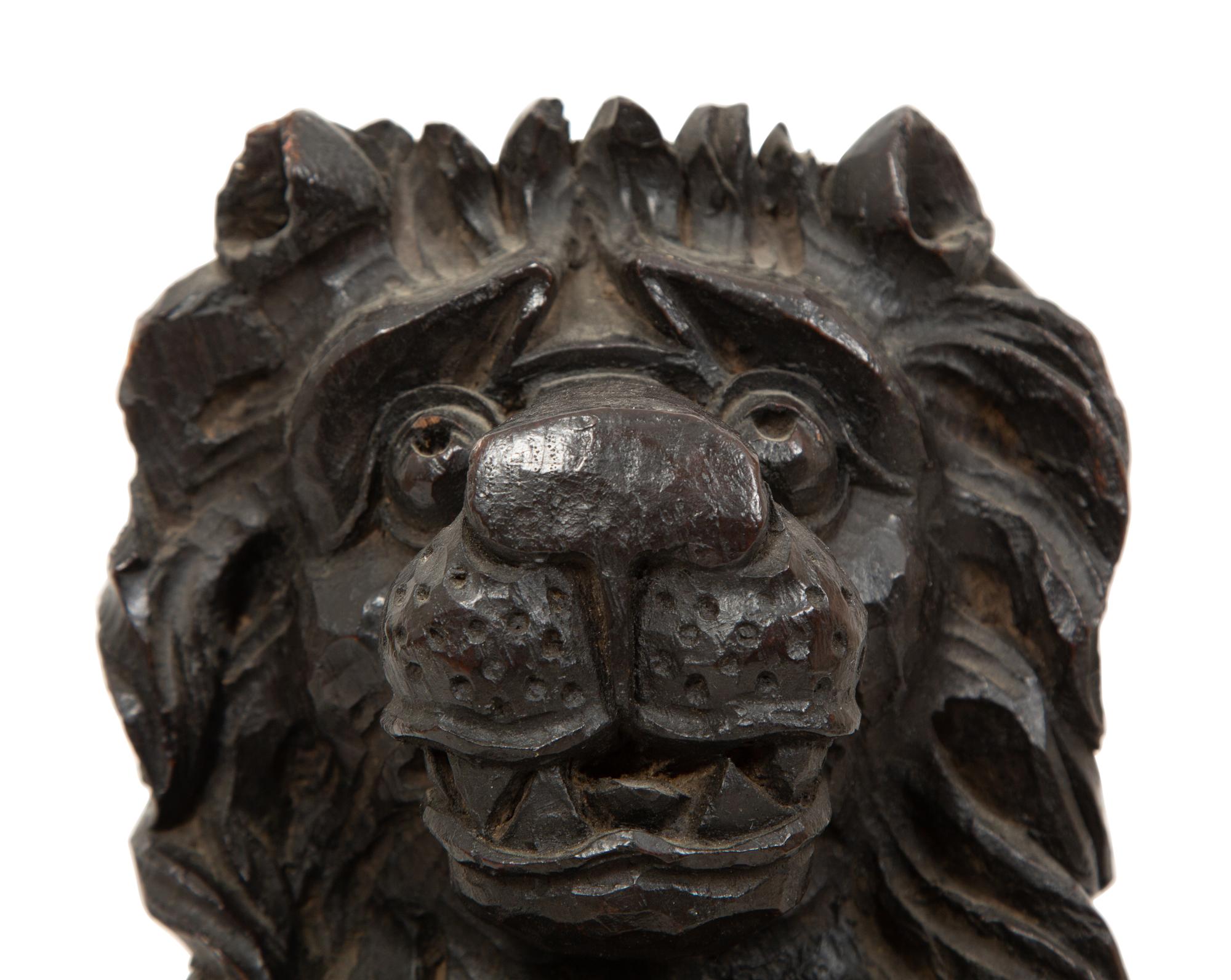 An English Carved and Stained Oak Figure of a Lion