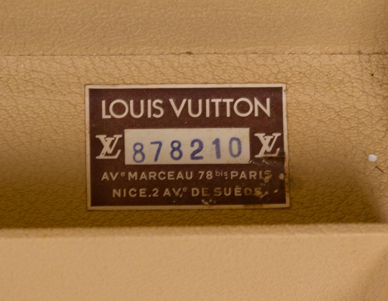 A Louis Vuitton Monogram Canvas Alzer Suitcase, 16" H x 23.5"W x 8.25"D; Handle drop: 2".