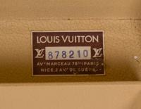A Louis Vuitton Monogram Canvas Alzer Suitcase, 16" H x 23.5"W x 8.25"D; Handle drop: 2".