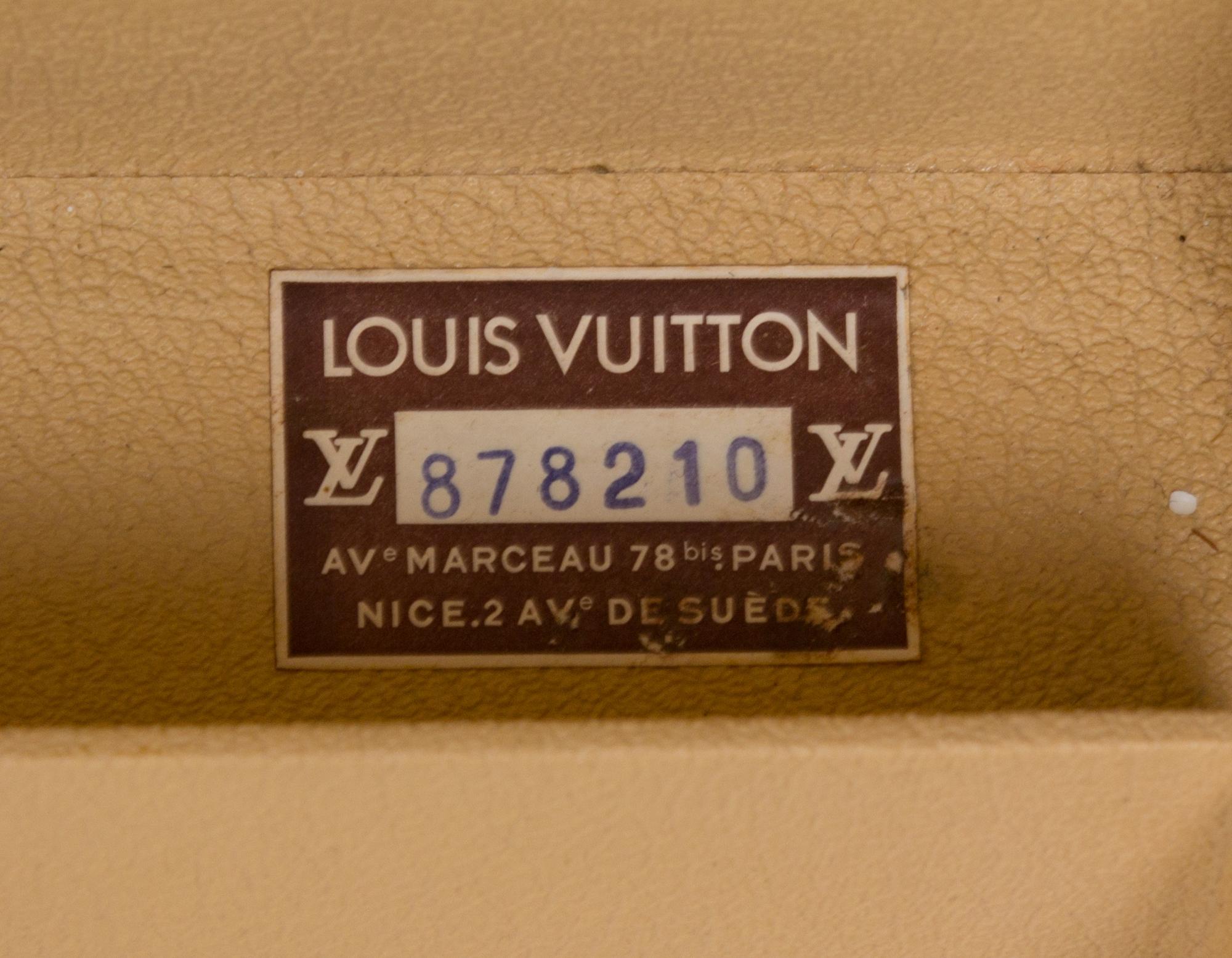 A Louis Vuitton Monogram Canvas Alzer Suitcase, 16" H x 23.5"W x 8.25"D; Handle drop: 2".