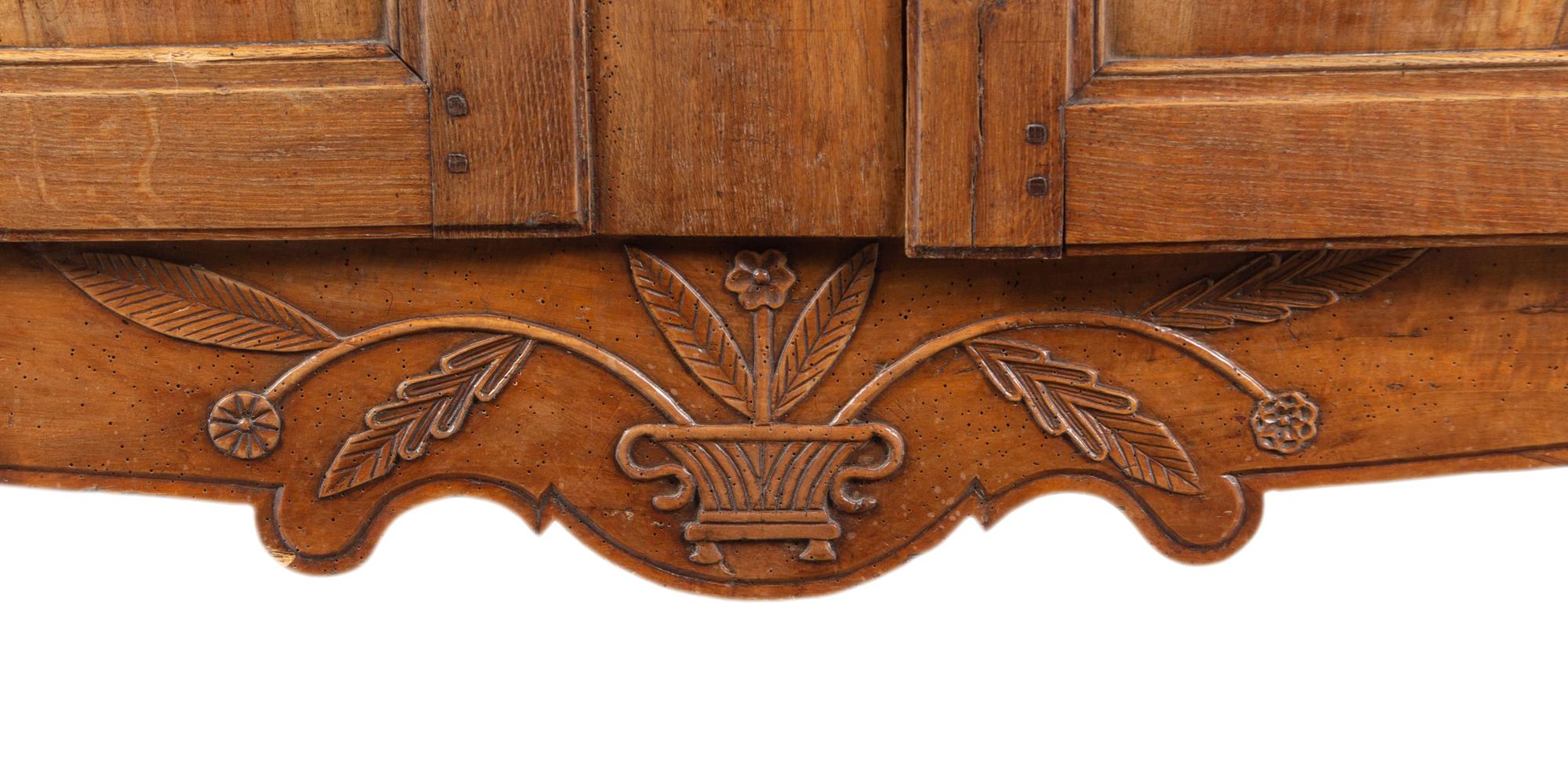 A French Provincial Walnut and Fruitwood Armoire