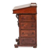 A Victorian Carved Mahogany Davenport Desk