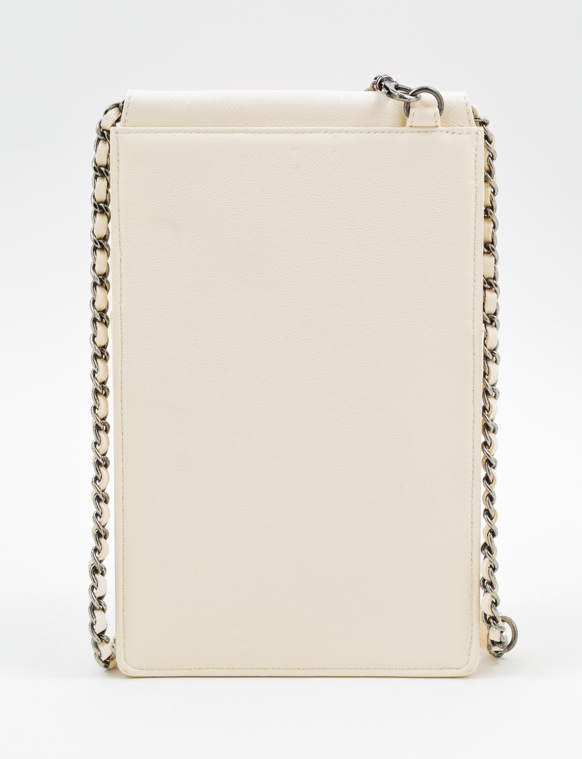 A Chanel Cream Leather Cross Body Pouch with Wallet, Bag: 5.5" x 10" x 1.5"; Wallet: 7.5" x 4.5" x 1.5".