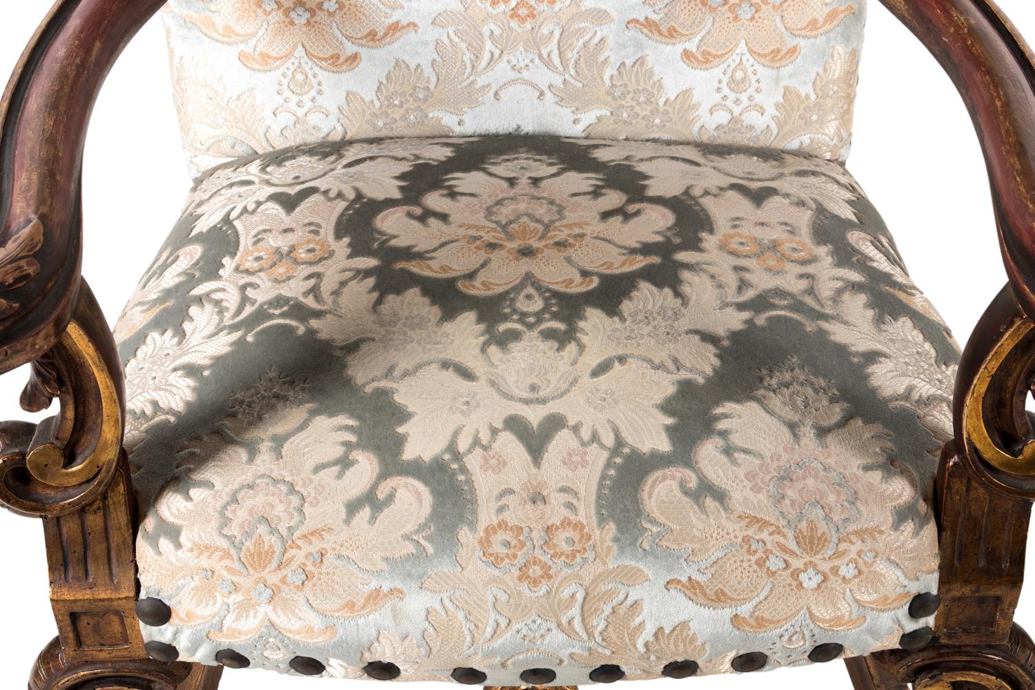 A Pair of Italian Baroque Style Parcel Gilt Walnut Armchairs