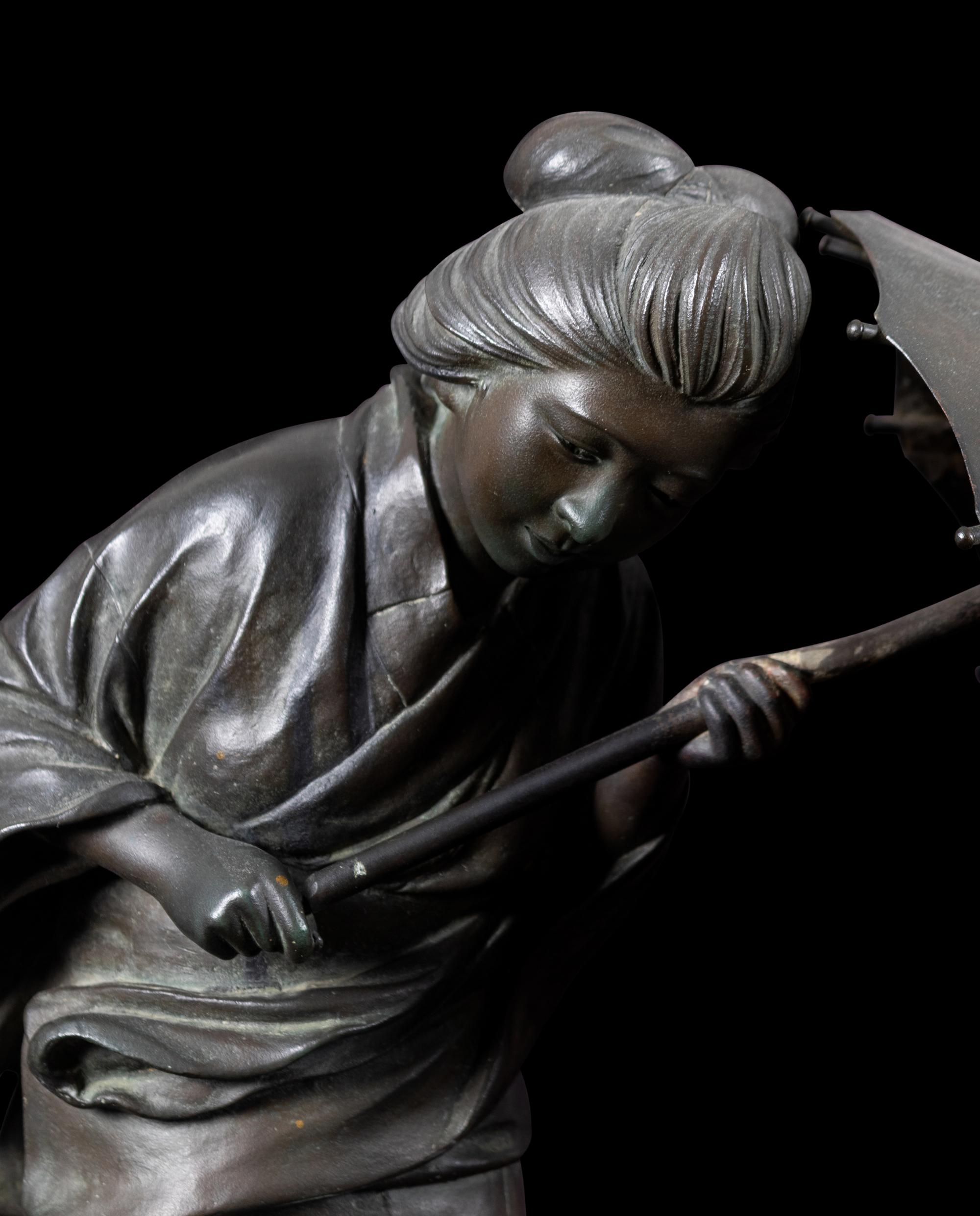 A Japanese Bronze Okimono of A Lady