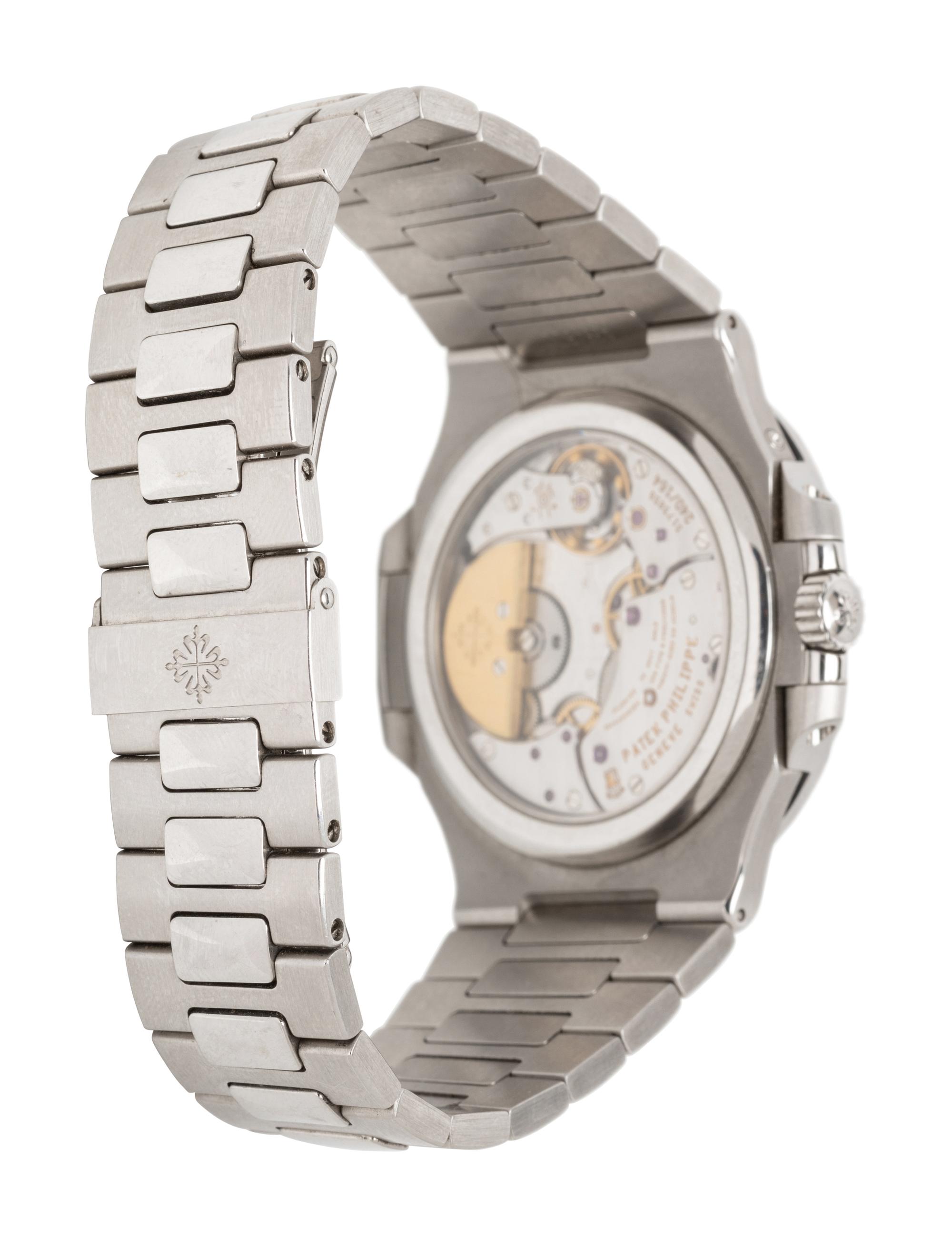PATEK PHILIPPE, REF. 5712/1A STAINLESS STEEL 'NAUTILUS' WATCH, BOX & PAPERS
