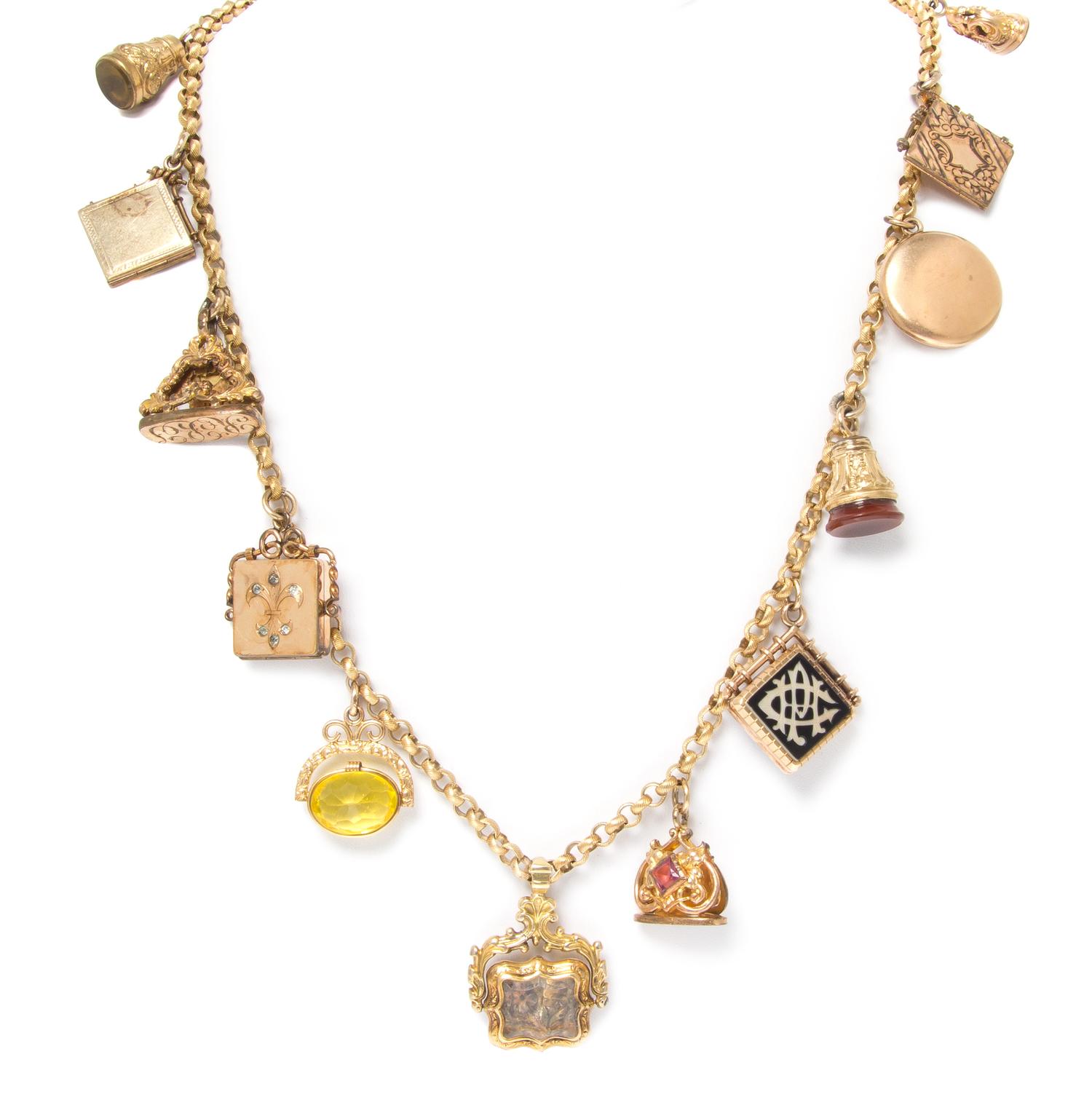 An Antique Longchain Necklace with 13 Attached Fobs and Lockets, 91.20 dwts.