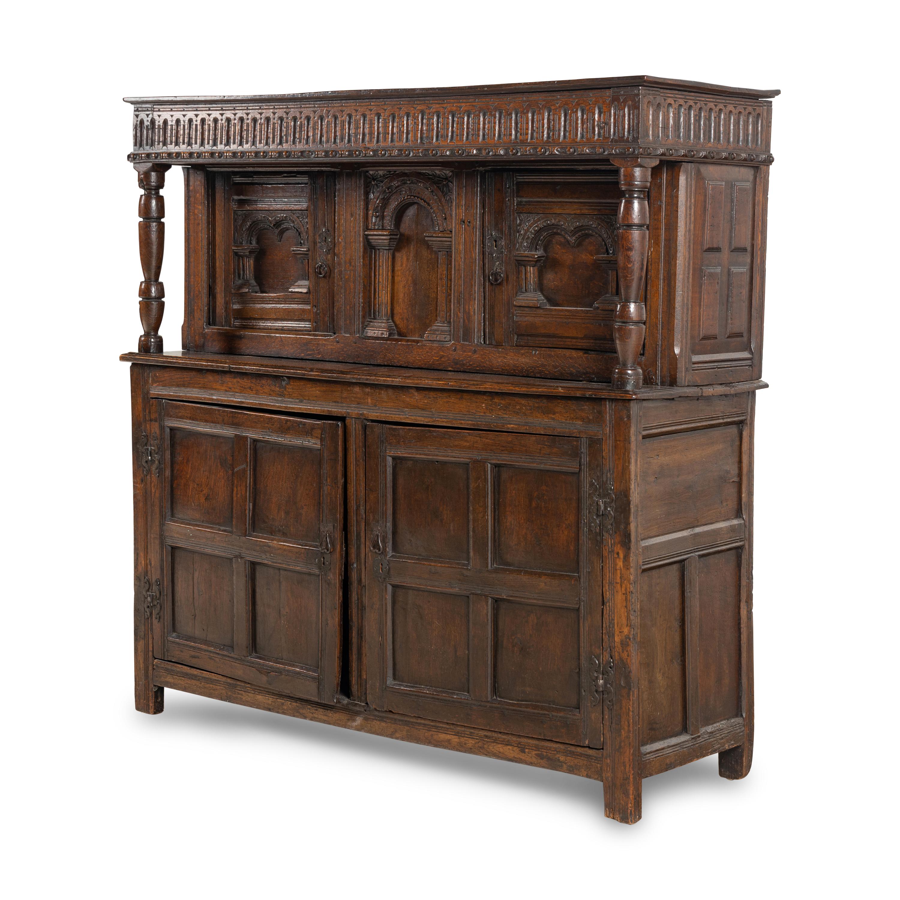 A Jacobean Carved Oak Court Cupboard