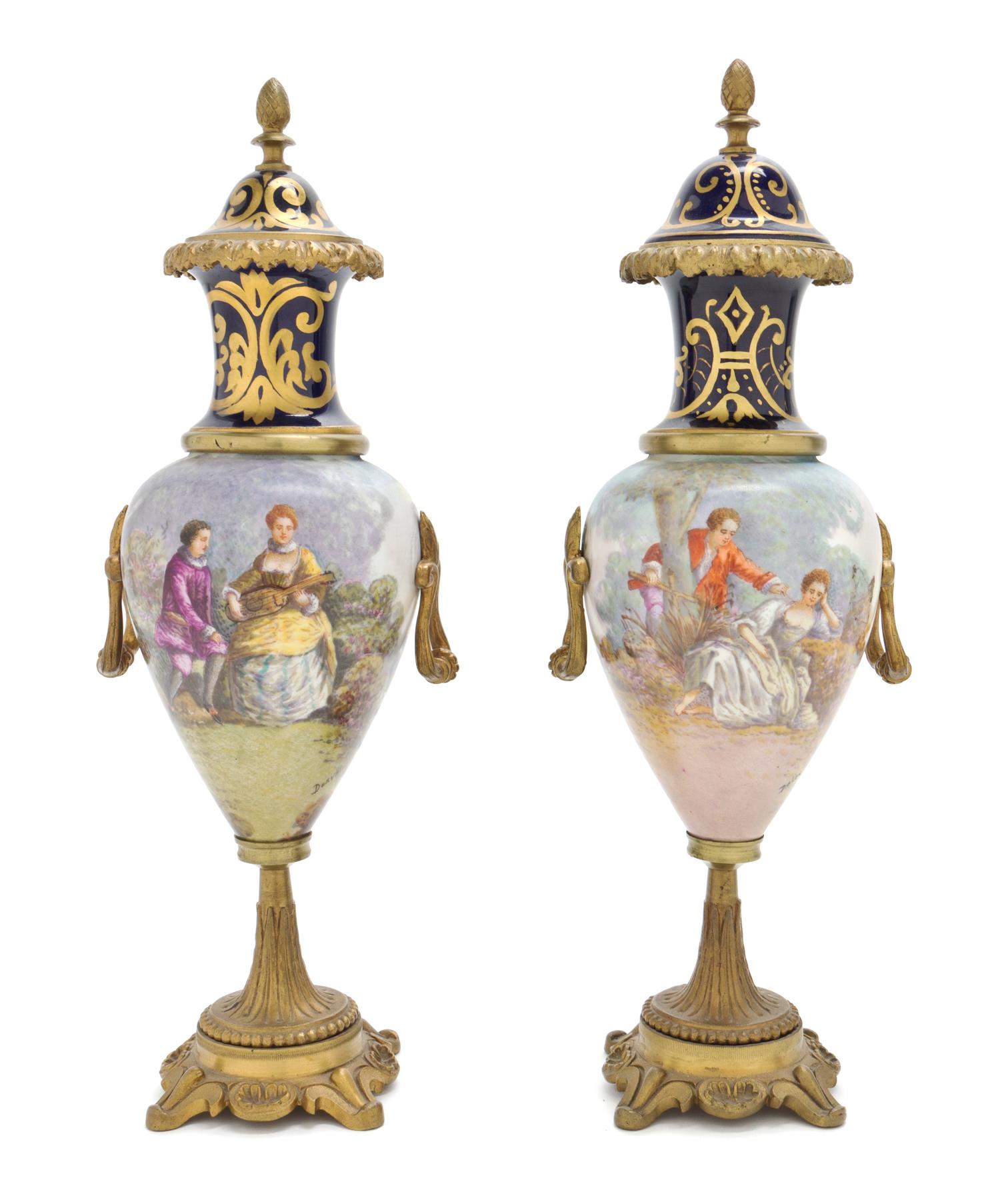 A Pair of Sevres Style Gilt Metal Mounted Porcelain Urns, Height 12 7/8 inches